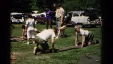 Hagerstown Maryland USA (1966): Two Boys Rolling A Sleeping Bag On The Grass With