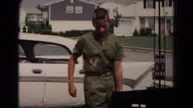HAGERSTOWN MARYLAND USA-1966: Father And Son Carrying Trunk To Car