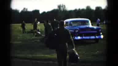 Hagerstown Maryland USA (1966): People In A Park Walking Across The Grass Near A