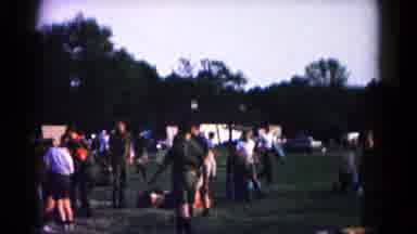 Hagerstown Maryland USA (1966): Many People Walk Around Large Field Then Two Flags