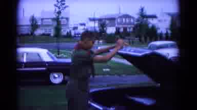 Hagerstown Maryland USA (1966): A Boy In A Boy Scout Uniform Closes A Car Trunk