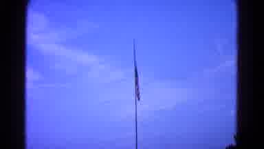 Hagerstown Maryland USA (1966): Flag Being Lowered In The Blue Sky With Few Clouds
