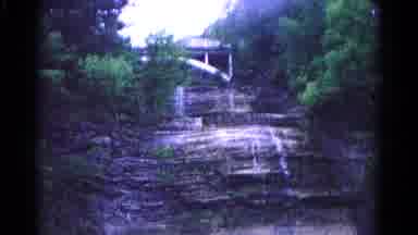 HAGERSTOWN MARYLAND USA-1966: Side Of A Cliff In A Forest With Water Trickling Down