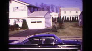 Hagerstown Maryland USA (1966): Young Man In Black Jacket Enters Black 70s Car
