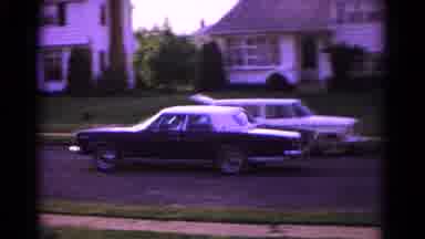 Hagerstown Maryland USA (1966): Woman With A Dress In A House And A Car Passing By