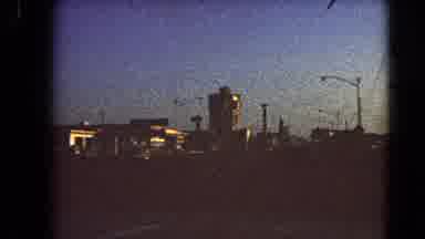 Las Vegas Nevada (1966): Slow Moving View Of A City And Roadway At Sunrise From A