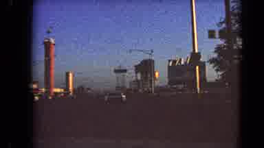 Las Vegas Nevada (1966): A Vehicle Travels Down A Street With Advertisement Signs
