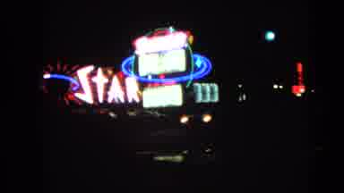 Las Vegas Nevada (1966): A Scene Of A City At Nighttime With Sign Stardust