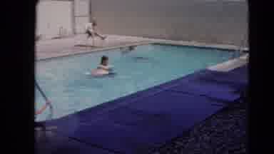 Las Vegas Nevada (1966): Some People In Swimming Caps Are Swimming Outside In The