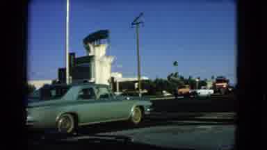 Las Vegas Nevada (1966): Sunny Day With Parked Green Car And Other Vehicles Parked
