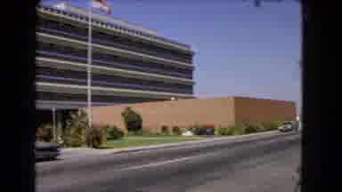 Los Angeles California (1966): Old Car Pulling Out Onto Road And Big Building With