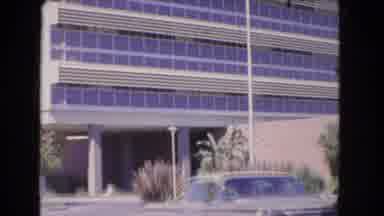 Los Angeles California (1966): Car Pulls Away From The Building With Many Windows