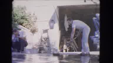 Los Angeles California (1966): Four Men Stand In A Driveway Vigorously Sweeping