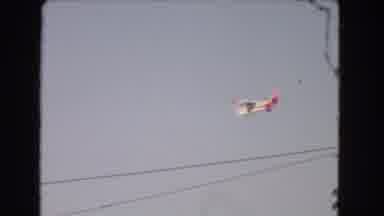 Los Angeles California (1966): An Airplane Flying In The Sky Filmed In Front Of