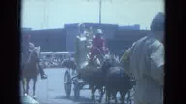 Milwaukee Wisconsin (1966): A Parade Walking With People Waving And A Cage With