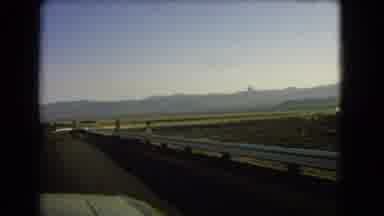 Nevada USA (1966): View Of Far Off Mountains As Seen From Long Highway In Morning