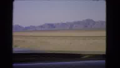 Nevada USA (1966): Mountains Are Seen Out The Window Of A Train Or Bus