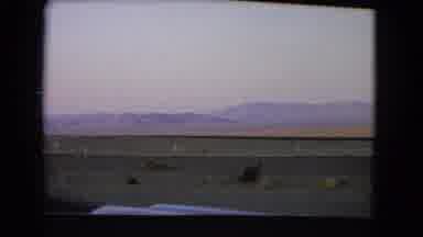 Nevada USA (1966): Flat Landscape With Hills In Background From Window Of Moving