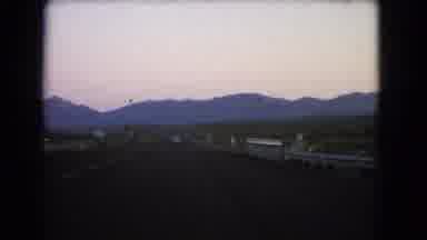 Nevada USA (1966): View Of Long Desert Road With Mountains And Open Sky In The