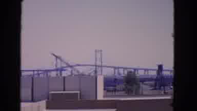San Pedro California USA (1966): A Bridge And Buildings And Three People Standing