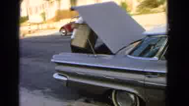 San Pedro California USA (1966): Man Is Carrying His Suitcase To Put Inside Car