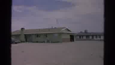 Silver Lake California (1966): View Of Buildings In Desert Environment Framed By