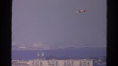 Silver Lake California (1966): Airplane Flying Over The City Near A Body Of Water