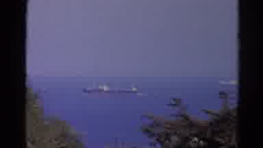 Silver Lake California (1966): Ship Floating Down Dark Blue Water Body Near Shore
