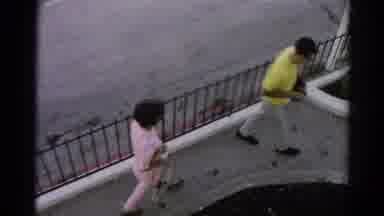 Silver Lake California (1966): A Man And Woman Walk Towards A Red And White Sports