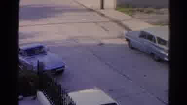 Silver Lake California (1966): Grey Car Pulls Out Of Parking Spot And Accelerates