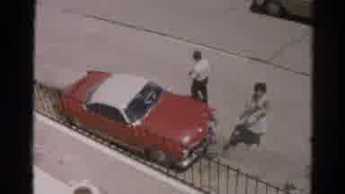 Silver Lake California (1966): Woman Gives A Man A Gift Before He Enters The Car