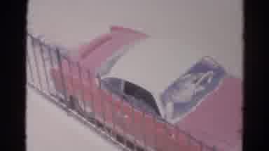 Silver Lake California (1966): An Older Red Car Seen To Be Passing Through The