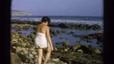 Silver Lake California (1966): Woman In A White Bathing Suit Carefully Walking In