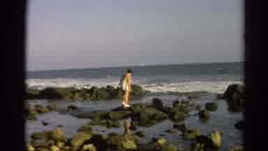 Silver Lake California (1966): Walking On Stones On The Beach With Waves And Sun