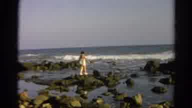 Silver Lake California (1966): Woman In A White Bathing Suit Skipping Across Rocks