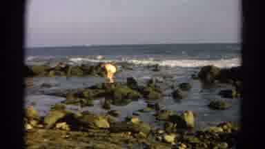 Silver Lake California (1966): Person Rocks Ocean Blue Sky Walking Water Wearing