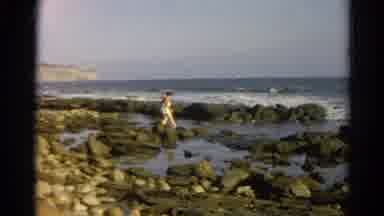 Silver Lake California (1966): Woman At The Beach Walking On Top Of Rocks In The