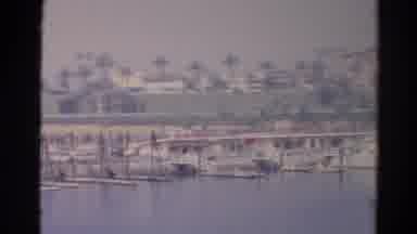 Silver Lake California (1966): View Of Docks From Moving Boat On A Sunny Day