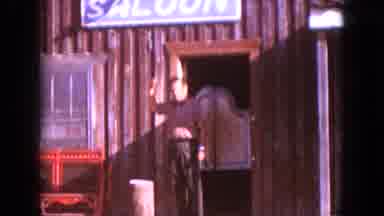 South Dakota USA (1966): Man Walks Away From The Swinging Door Of A Building