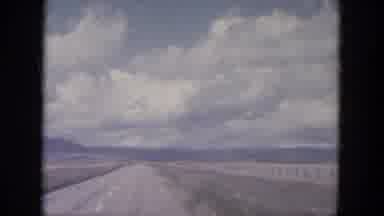 South Dakota USA (1966): A View Of A Road A Fence And A Vast Field With Mountains