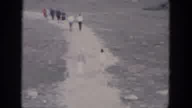 South Dakota USA (1966): A Lot Of People Walking Along White Path Towards Snowy
