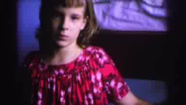 Brazil (1967): Female Child In Bedroom Wearing Red Dress Opens Large Wardrobe