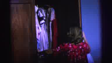Brazil (1967): Young Girl Looking Through A Wardrobe With A Load Of Clothes In It