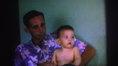 Brazil (1967): Parent Holds His Son In His Blue Shirt With Flowers