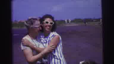 Brazil (1967): Mother Daughter And Granddaughter Hold Bags On A Windy Beach While