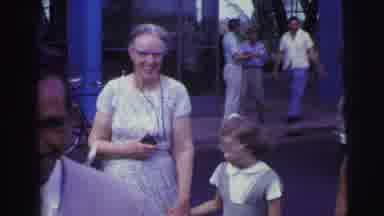 Brazil (1967): Family Walk Outside Together While A Man Stops To Fix His Broken