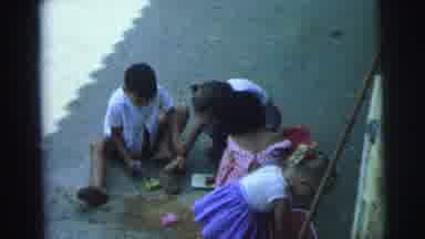 Brazil (1967): Children Playing Together Outside In Driveway With Sand Box Toys