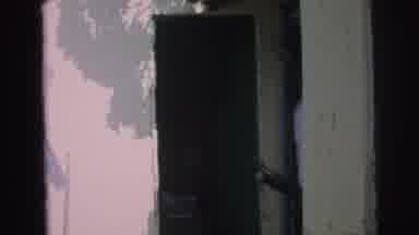 Brazil (1967): Someone Walks Into A Doorway While Clothes Are Blowing On A