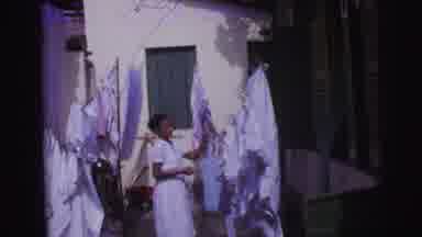 Brazil (1967): Young Woman Hangs Laundry On The Clothesline Where It Will Dry