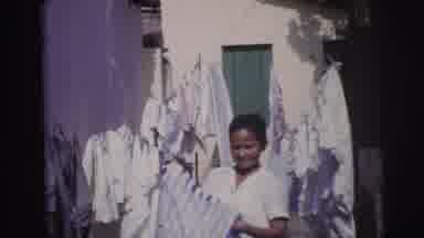 Brazil (1967): Amateur Home Video Of A Young Ethnic Woman Folding Clothes On A